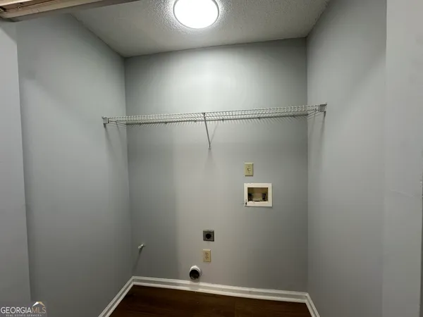 a bathroom with a window and a shower