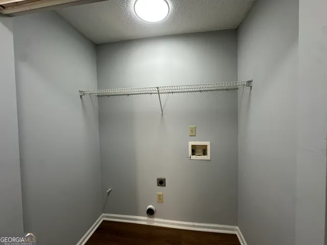 a bathroom with a window and a shower