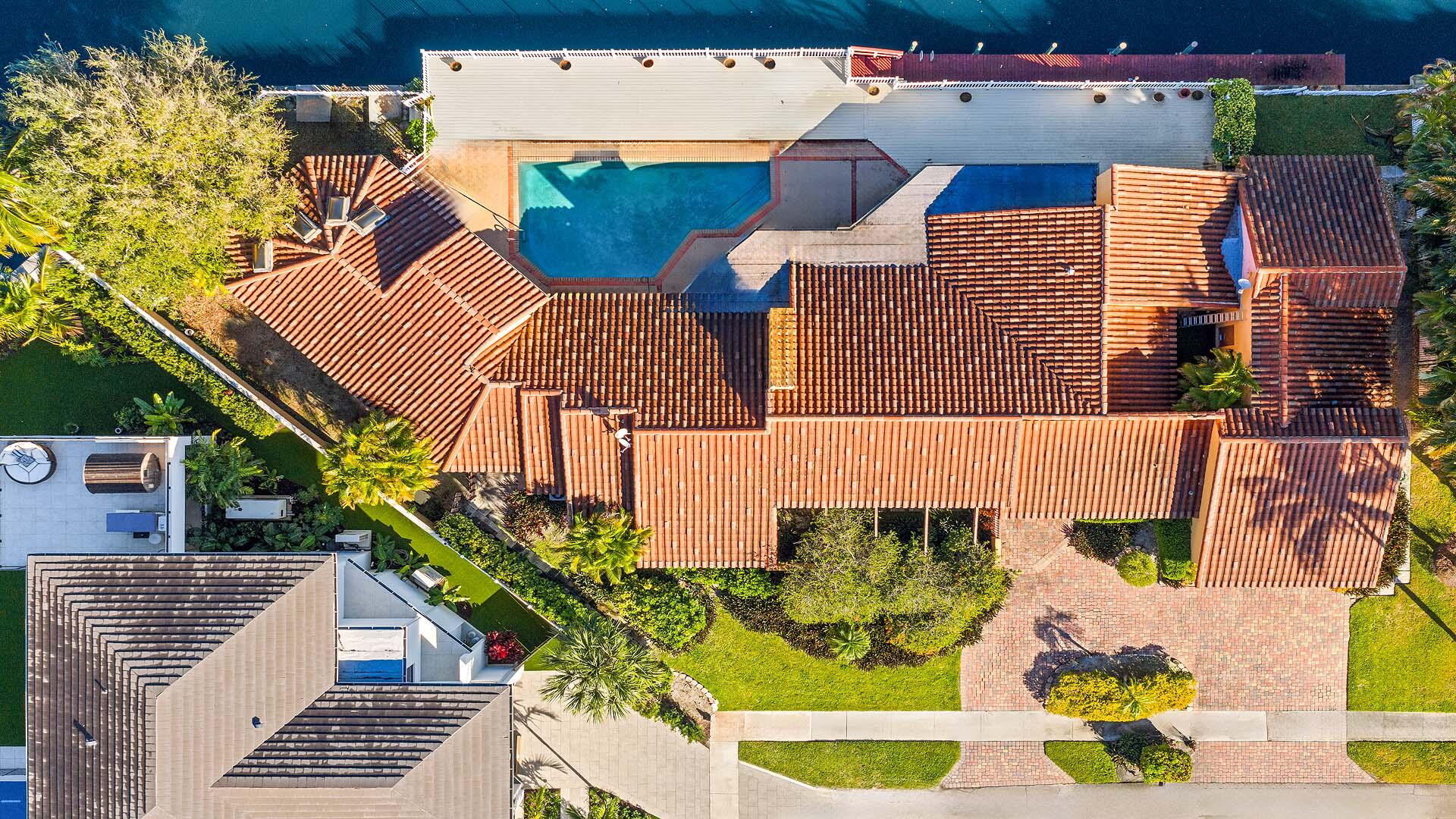 7401 Northeast Bay Cove Court Boca Raton, FL 33487 - Photo 9 of 11 an aerial view of a house with a yard