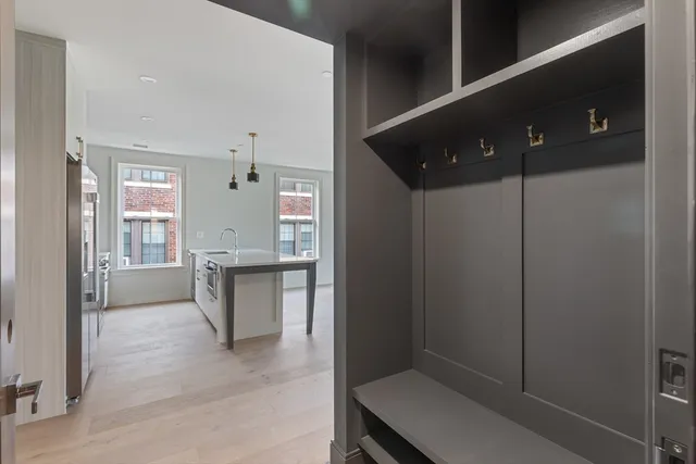 a view of kitchen with refrigerator and window