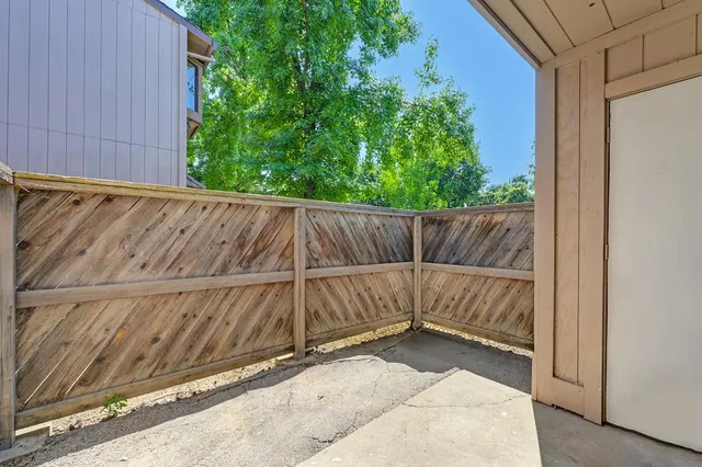 a view of outdoor space and wooden fence