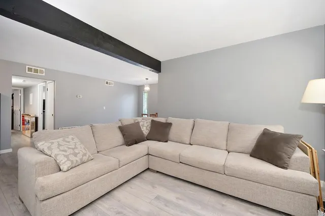 a living room with furniture and a couch