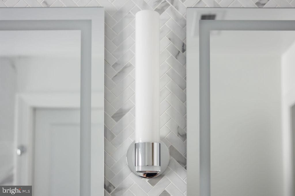 1200 Potomac Street Northwest Washington, DC 20007 - Photo 22 of 37 a bathroom with a glass shower door