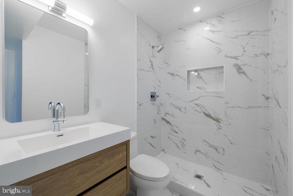 1200 Potomac Street Northwest Washington, DC 20007 - Photo 29 of 37 a bathroom with a sink toilet and shower