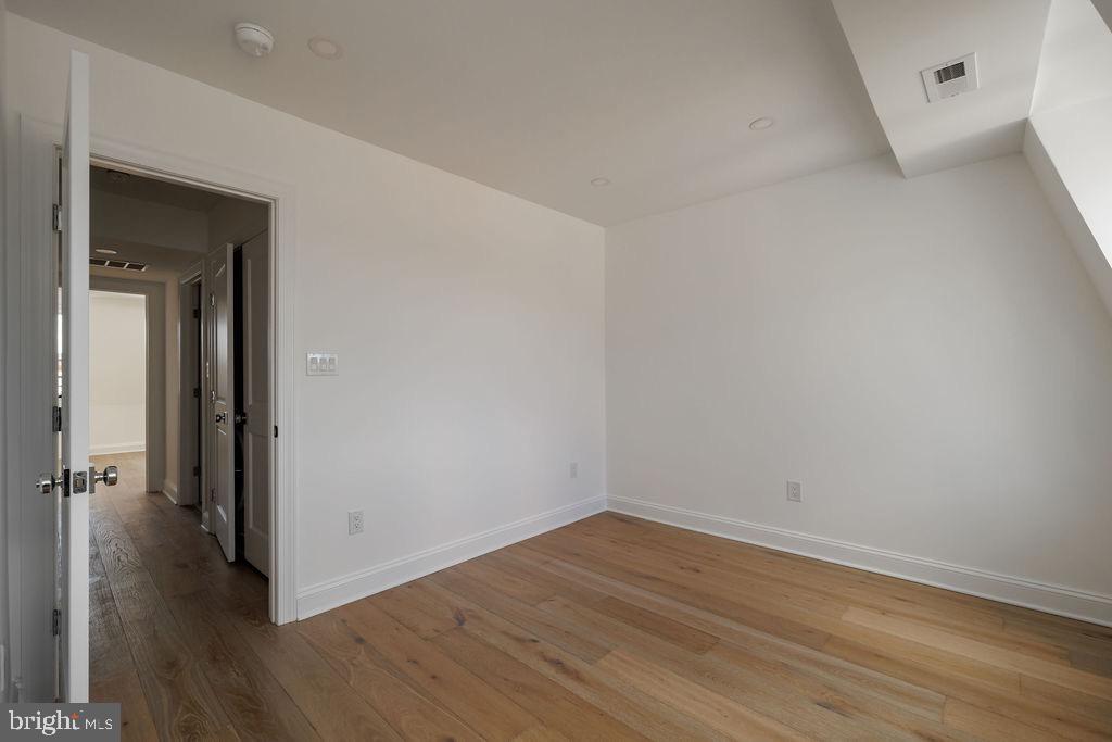 1200 Potomac Street Northwest Washington, DC 20007 - Photo 33 of 37 a view of a room with wooden floor