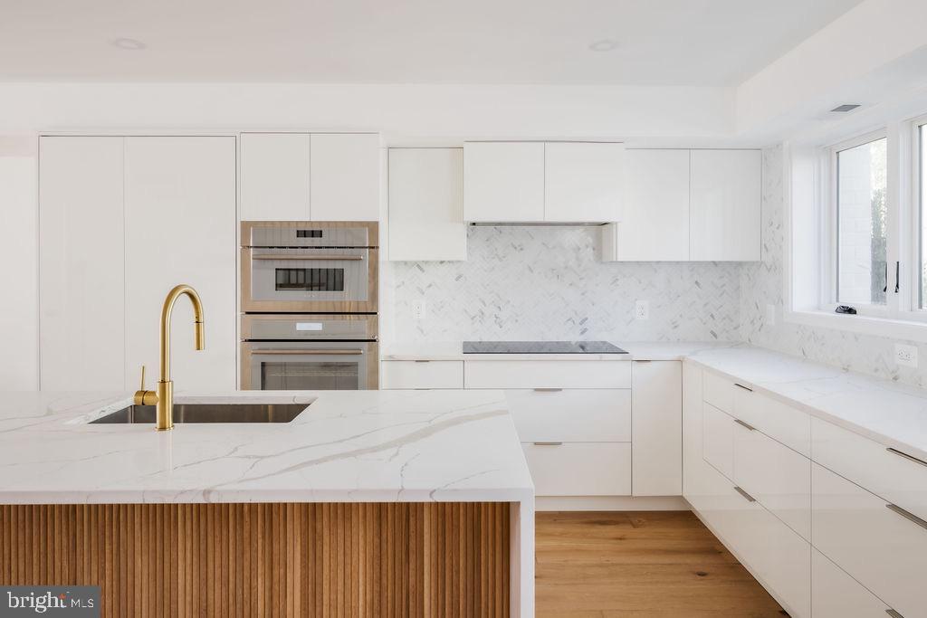 1200 Potomac Street Northwest Washington, DC 20007 - Photo 6 of 37 a kitchen with cabinets and appliances