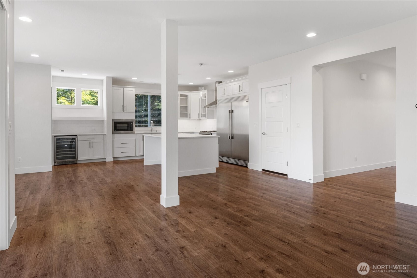 8711 27th Street East Edgewood, WA 98371 - Photo 11 of 40 a view of kitchen with furniture and wooden floor