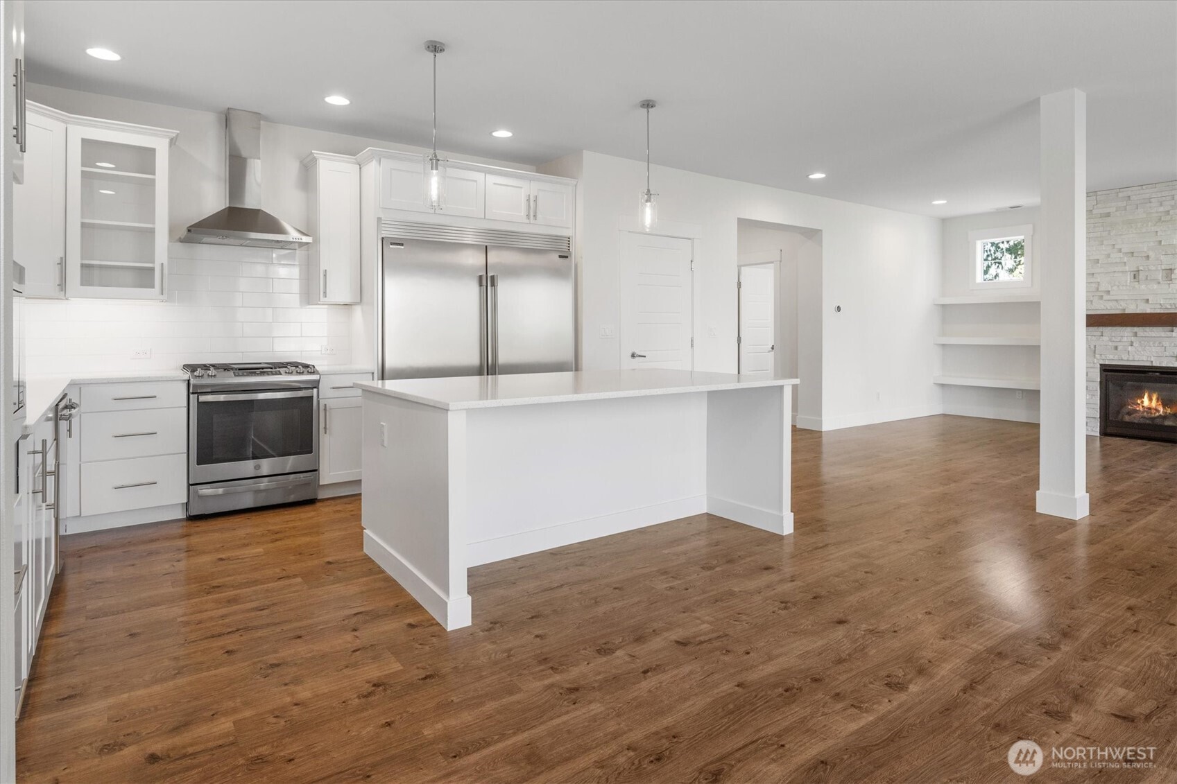 8711 27th Street East Edgewood, WA 98371 - Photo 18 of 40 a view of kitchen with wooden floor
