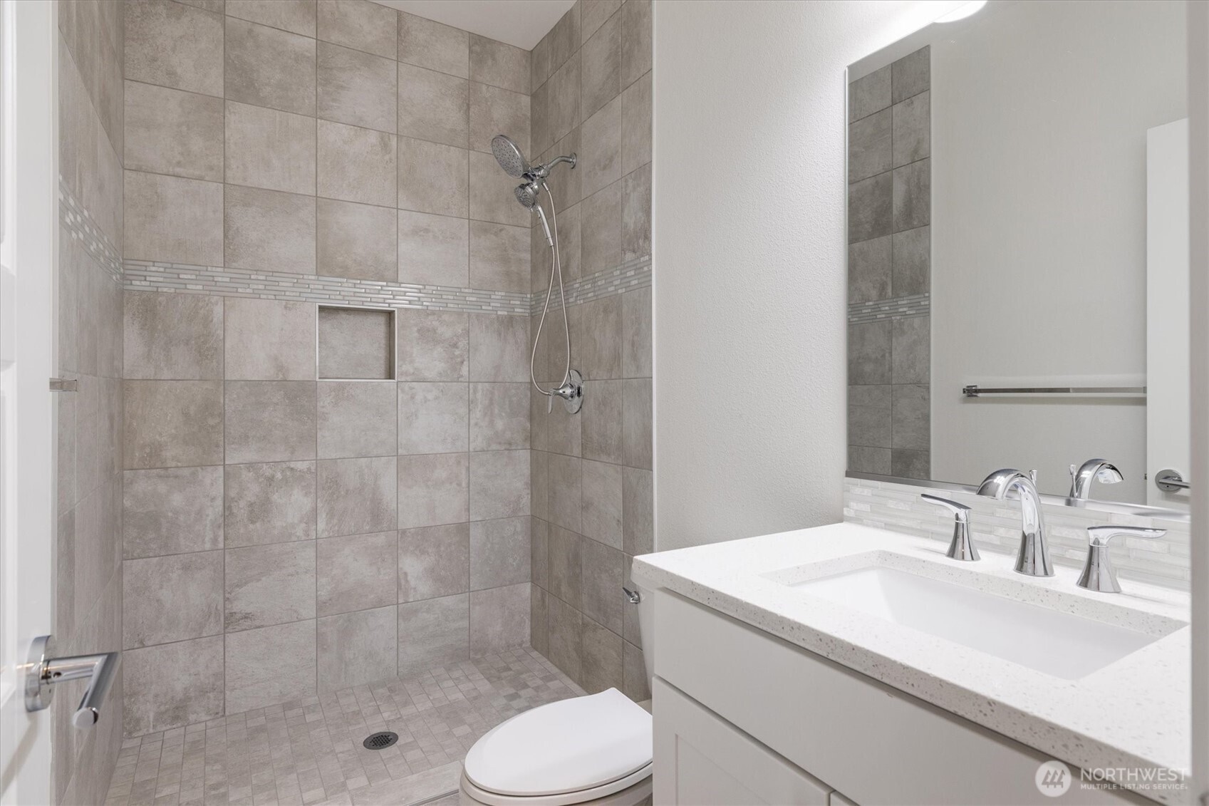 8711 27th Street East Edgewood, WA 98371 - Photo 20 of 40 a bathroom with a sink toilet and shower