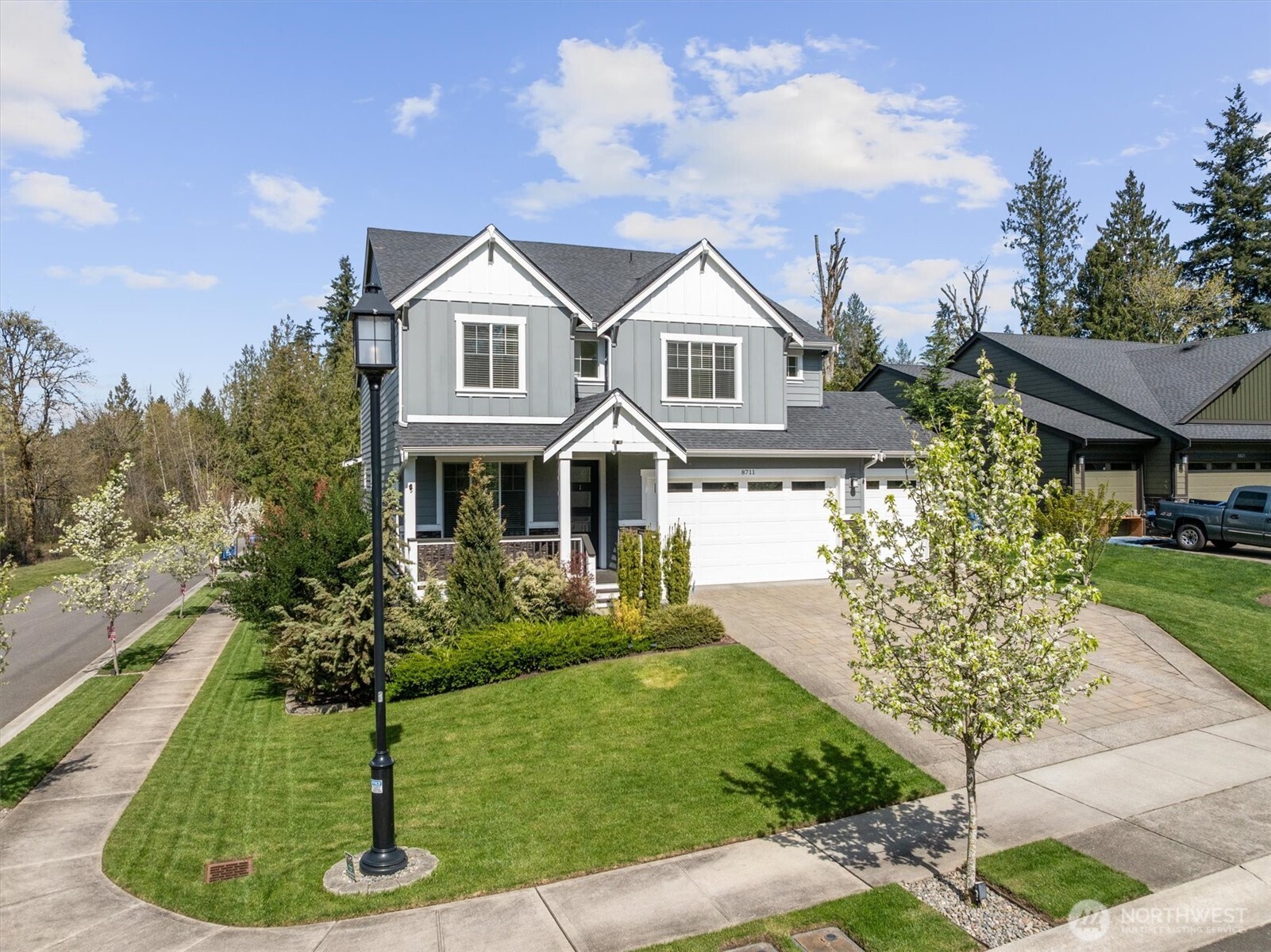8711 27th Street East Edgewood, WA 98371 - Photo 2 of 40 a front view of a house with a yard