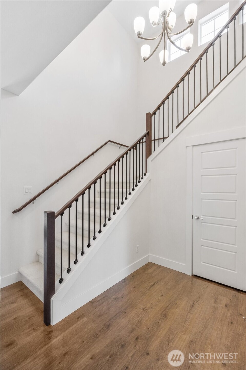 8711 27th Street East Edgewood, WA 98371 - Photo 21 of 40 a view of staircase with wooden floor and fan