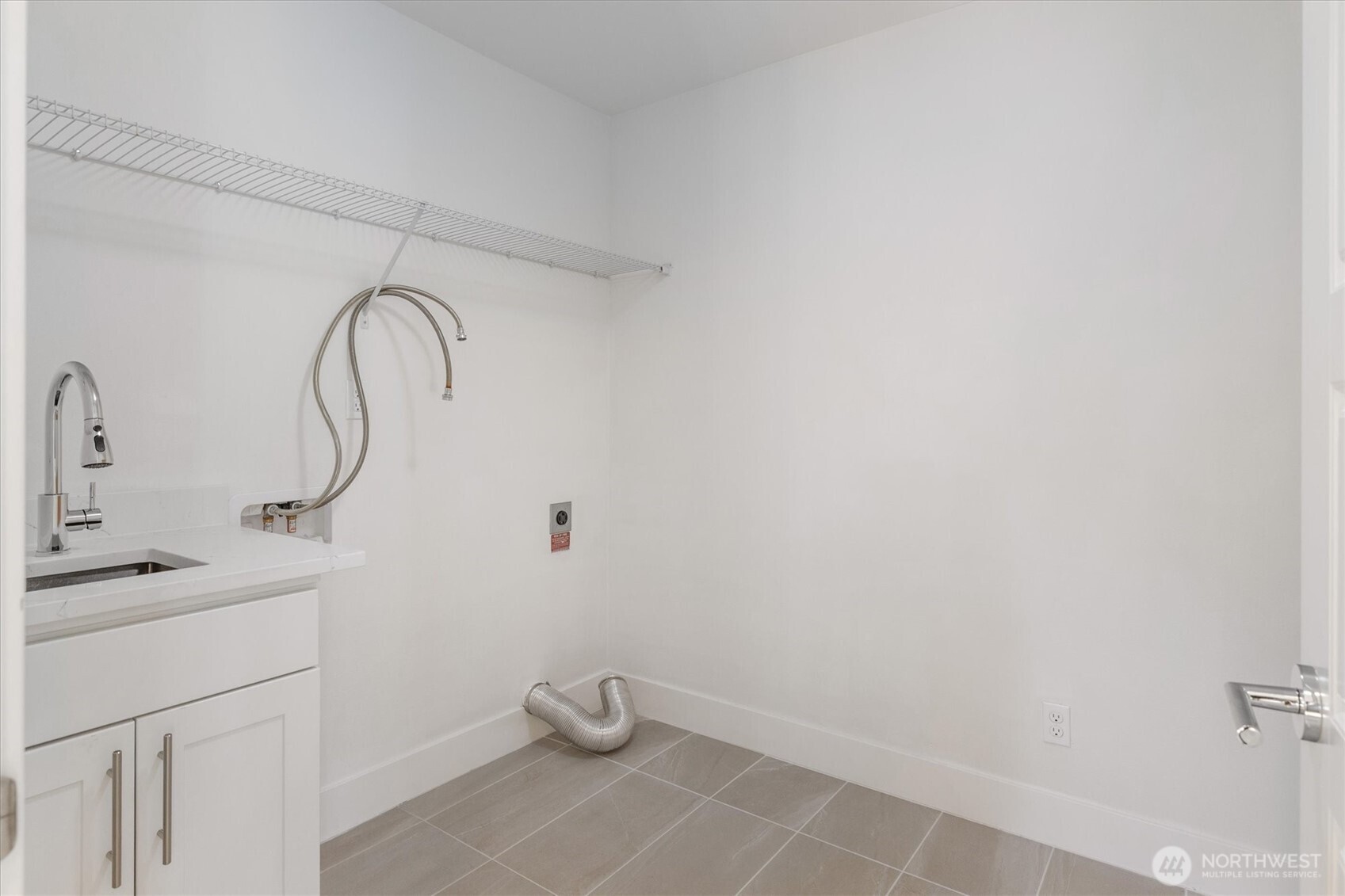 8711 27th Street East Edgewood, WA 98371 - Photo 30 of 40 a bathroom with a sink and a mirror