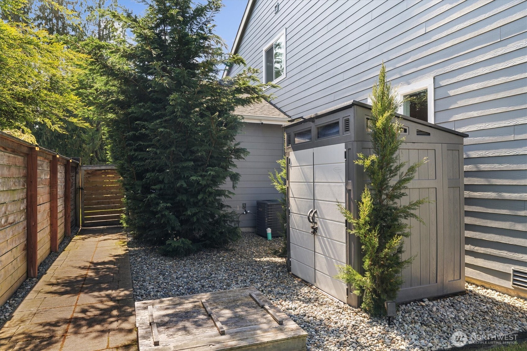 8711 27th Street East Edgewood, WA 98371 - Photo 31 of 40 a house that has a tree in front of the house