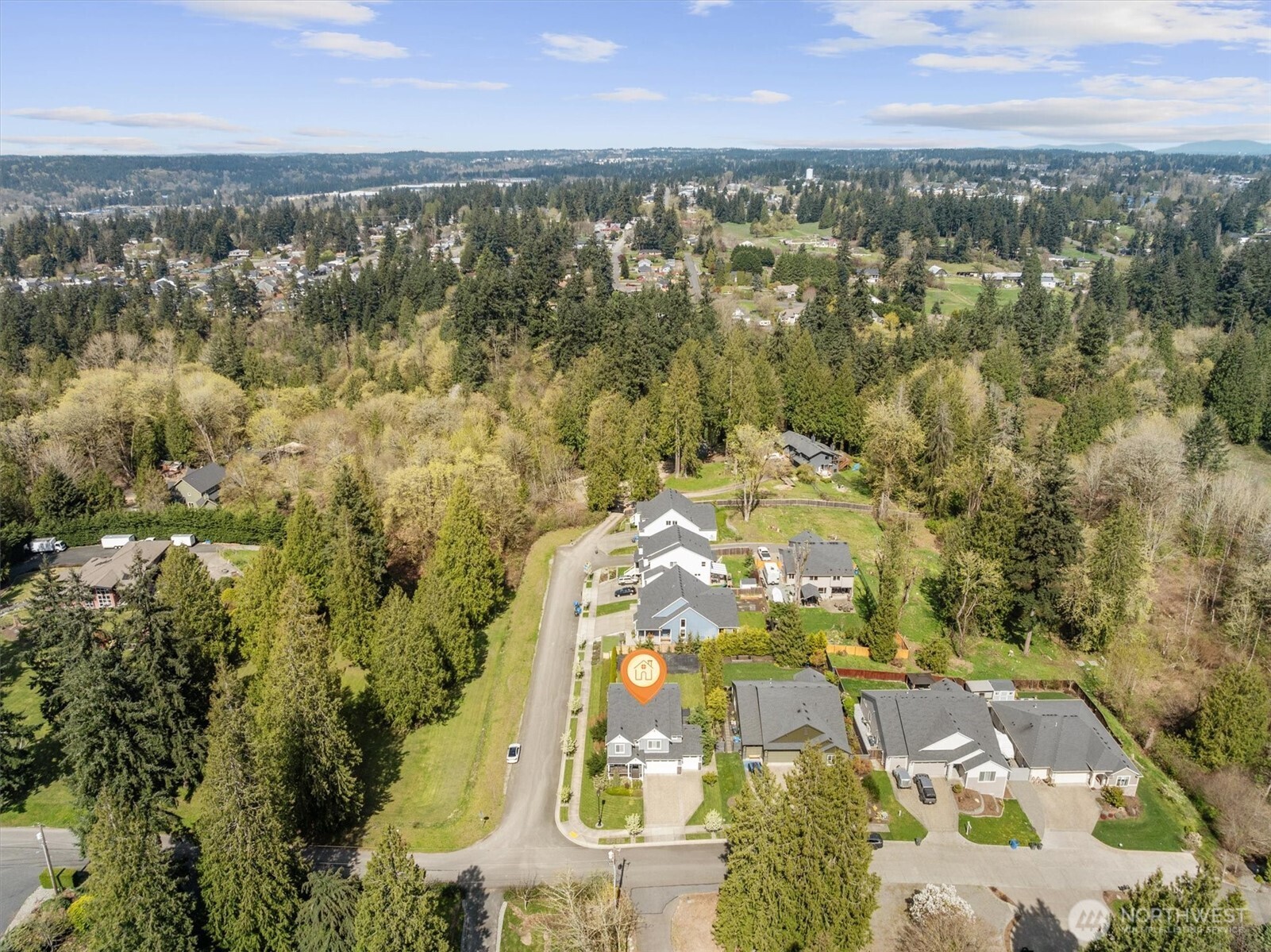 8711 27th Street East Edgewood, WA 98371 - Photo 37 of 40 an aerial view of residential houses with outdoor space
