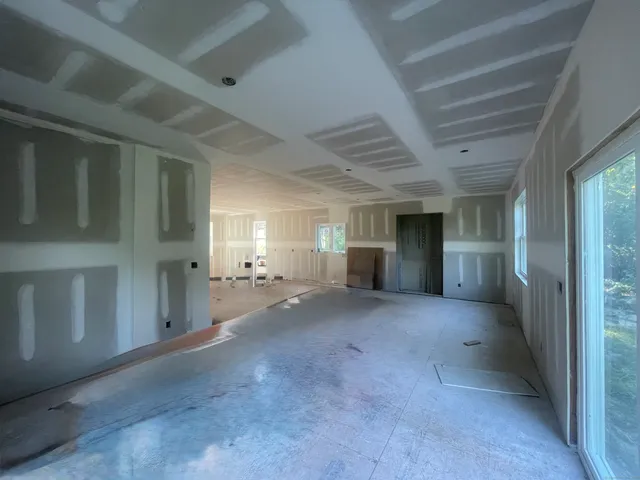 a view of a big room with closet and windows