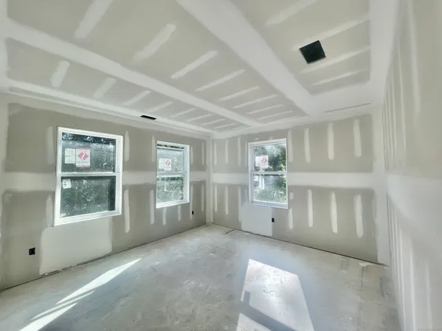 a view of a hallway with windows