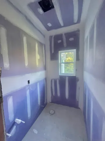 a bathroom with a bathtub and shower