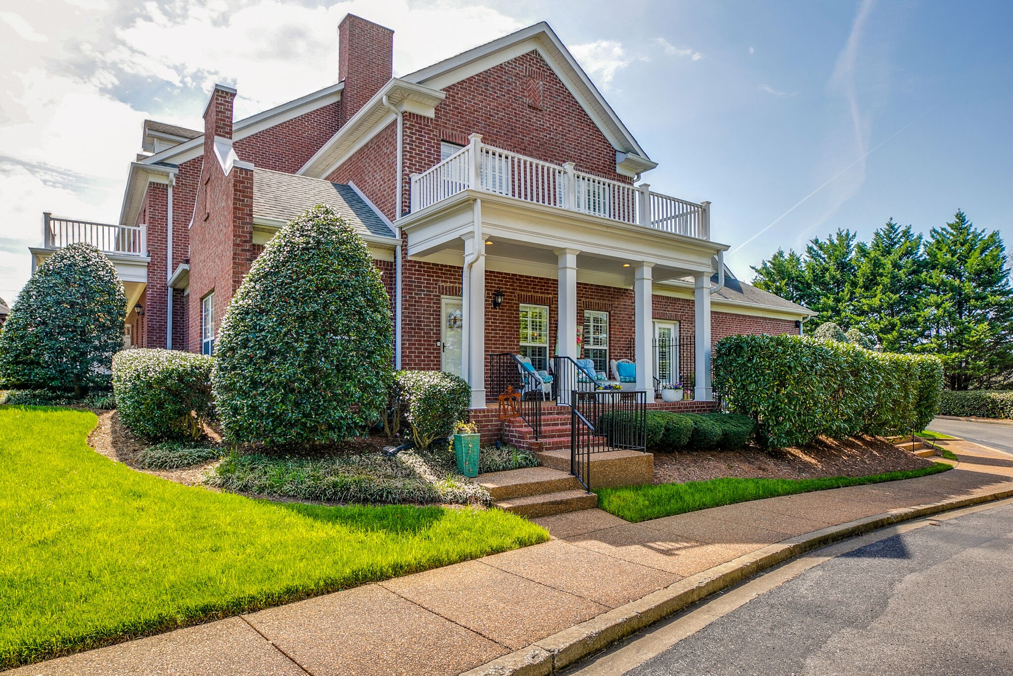 a front view of a house with garden