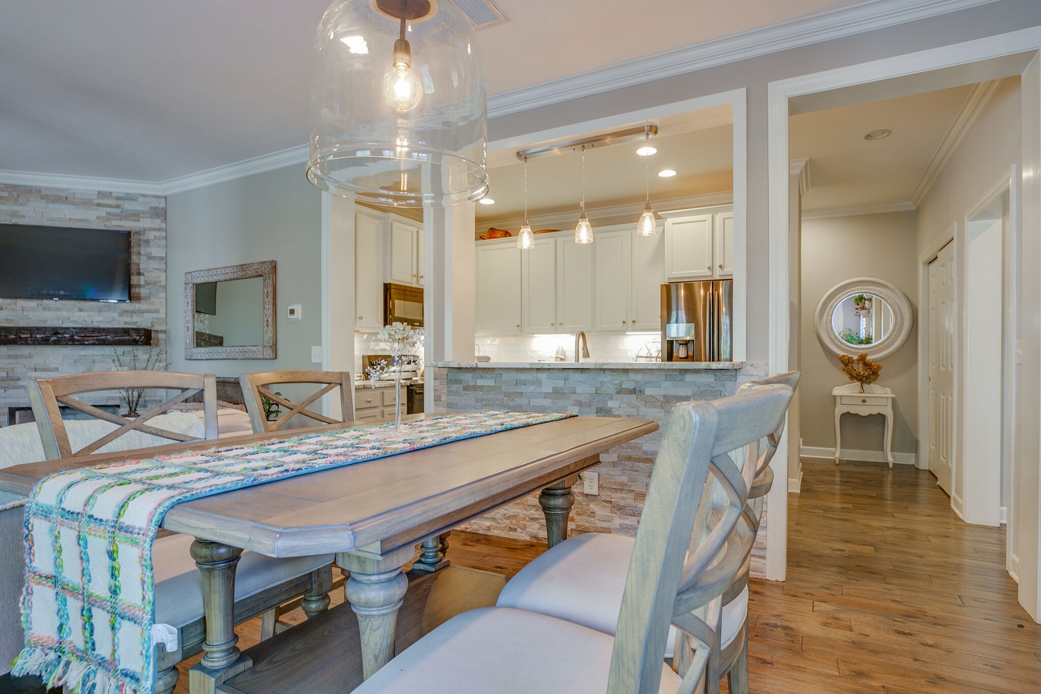 136 Ormesby Place Franklin, TN 37064 - Photo 14 of 41 a dining hall with stainless steel appliances granite countertop a sink table and chairs