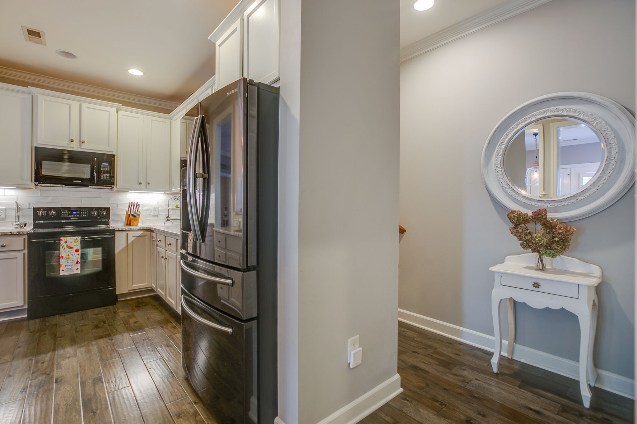 136 Ormesby Place Franklin, TN 37064 - Photo 22 of 41 a kitchen with stainless steel appliances a refrigerator a stove a sink and a microwave