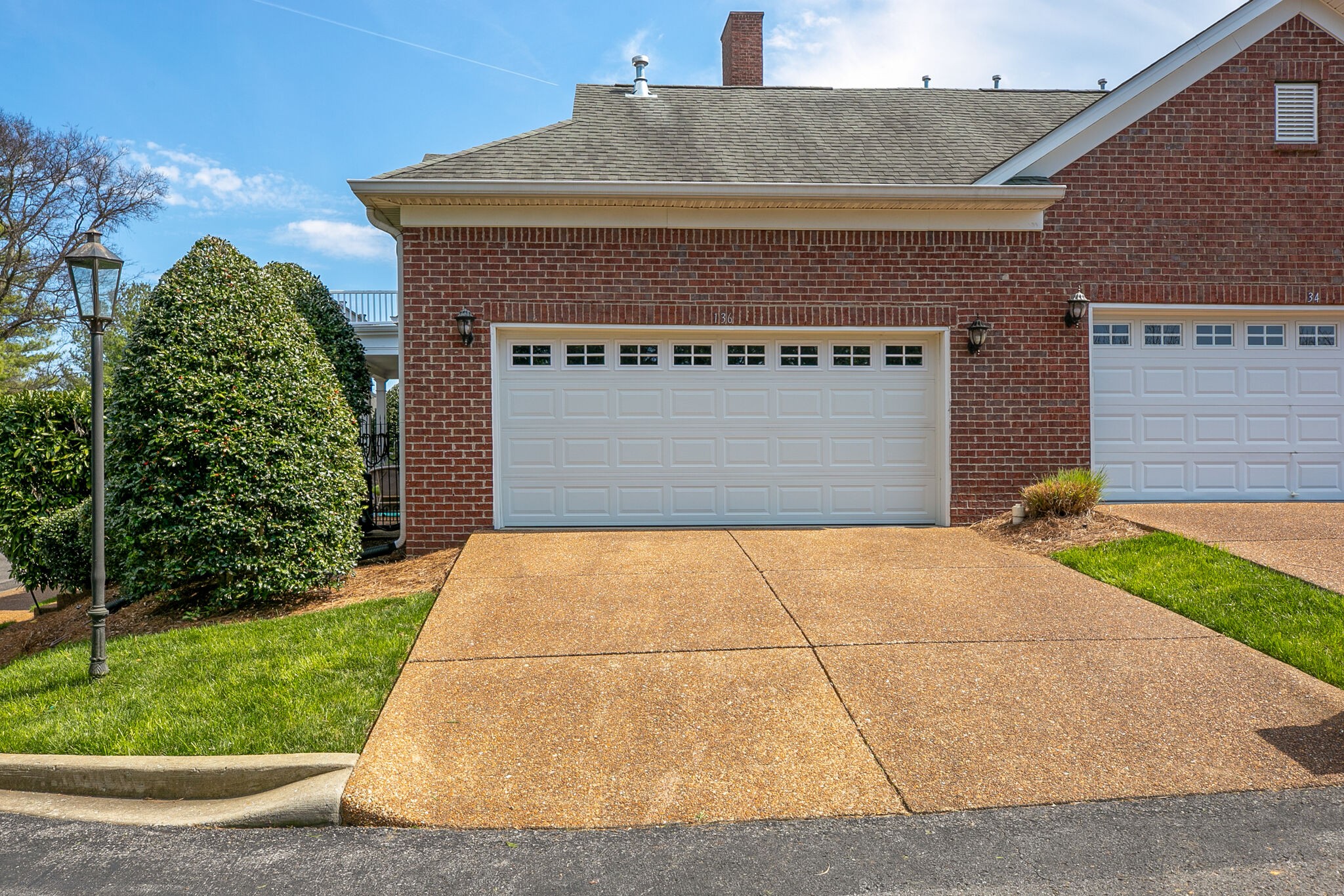 136 Ormesby Place Franklin, TN 37064 - Photo 4 of 41 a front view of a house with garden