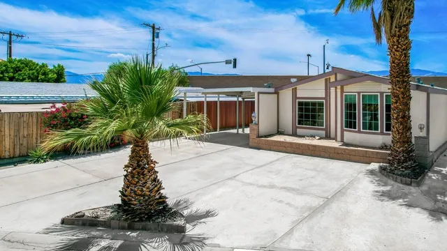 a porch with yard and barbeque oven