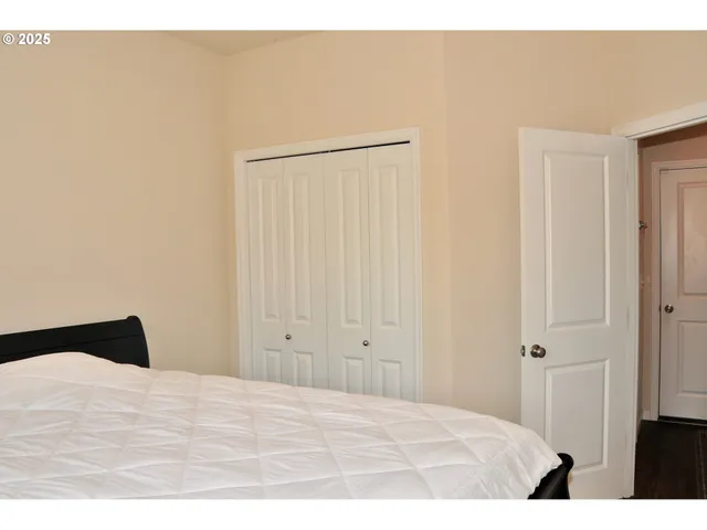 a bedroom with a bed and a black countertop