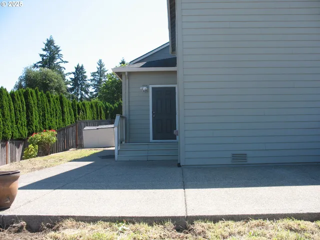 a view of backyard with cabin