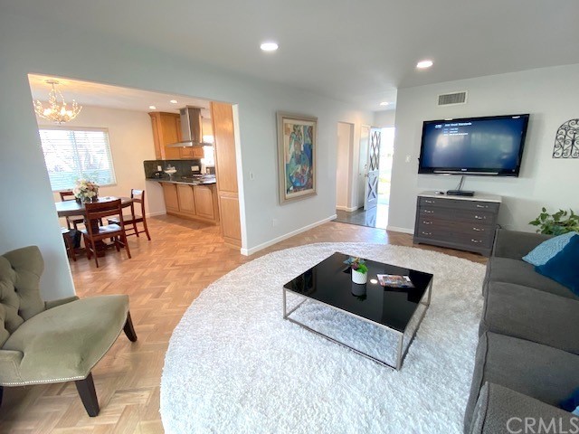 525 East 246th Street Carson, CA 90745 - Photo 16 of 41 a living room with furniture and a flat screen tv