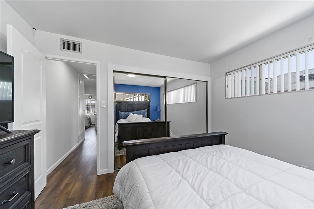 525 East 246th Street Carson, CA 90745 - Photo 18 of 41 a bedroom with a bed and a flat tv screen on dresser