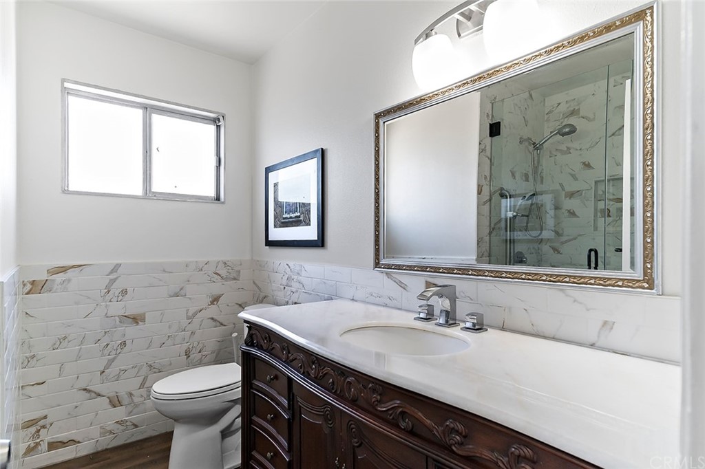 525 East 246th Street Carson, CA 90745 - Photo 19 of 41 a bathroom with a sink toilet and shower