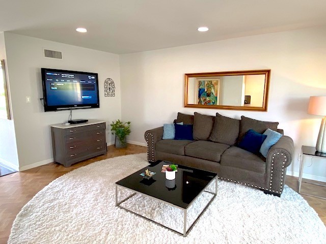 525 East 246th Street Carson, CA 90745 - Photo 2 of 41 a living room with furniture and a flat screen tv
