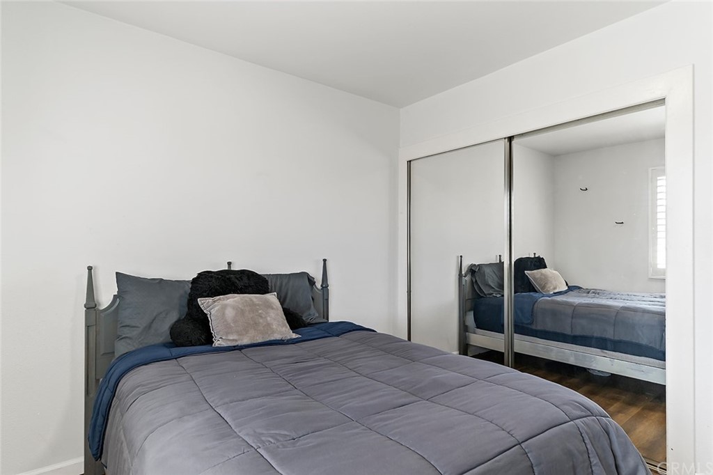 525 East 246th Street Carson, CA 90745 - Photo 21 of 41 a bedroom with a bed and a mirror