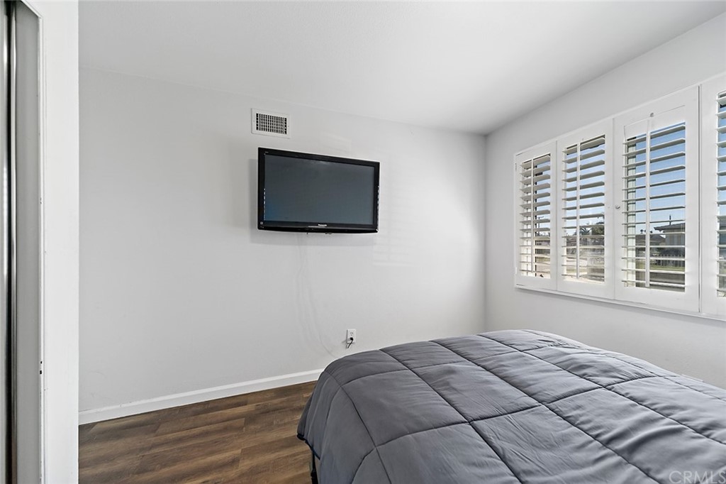 525 East 246th Street Carson, CA 90745 - Photo 22 of 41 a bedroom with a bed and a flat screen tv