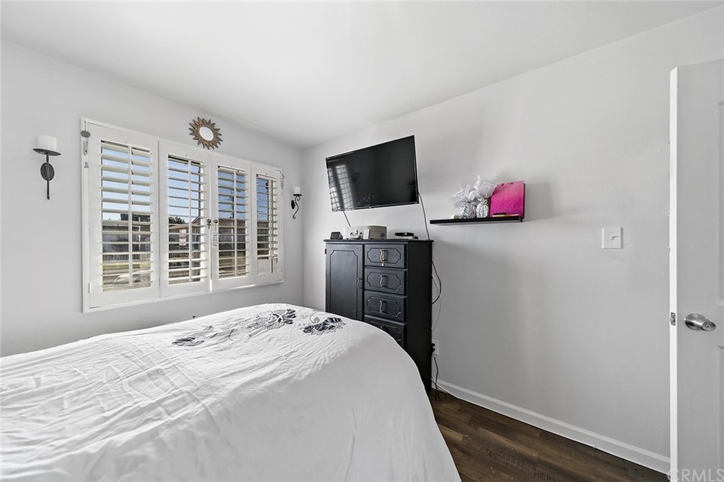 525 East 246th Street Carson, CA 90745 - Photo 23 of 41 a bedroom with a bed and flat screen tv