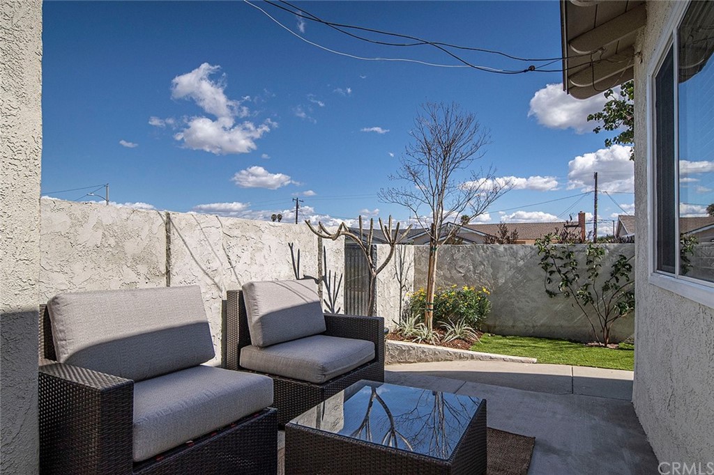 525 East 246th Street Carson, CA 90745 - Photo 33 of 41 a view of a balcony with a dining table and chairs with wooden floor