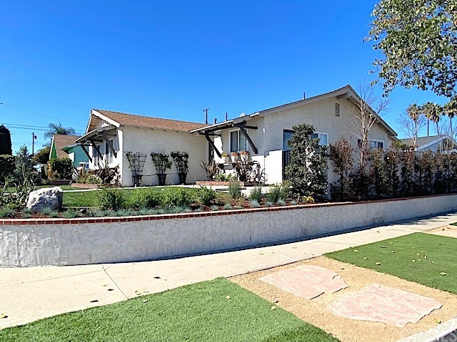 525 East 246th Street Carson, CA 90745 - Photo 36 of 41 a front view of a house with garden