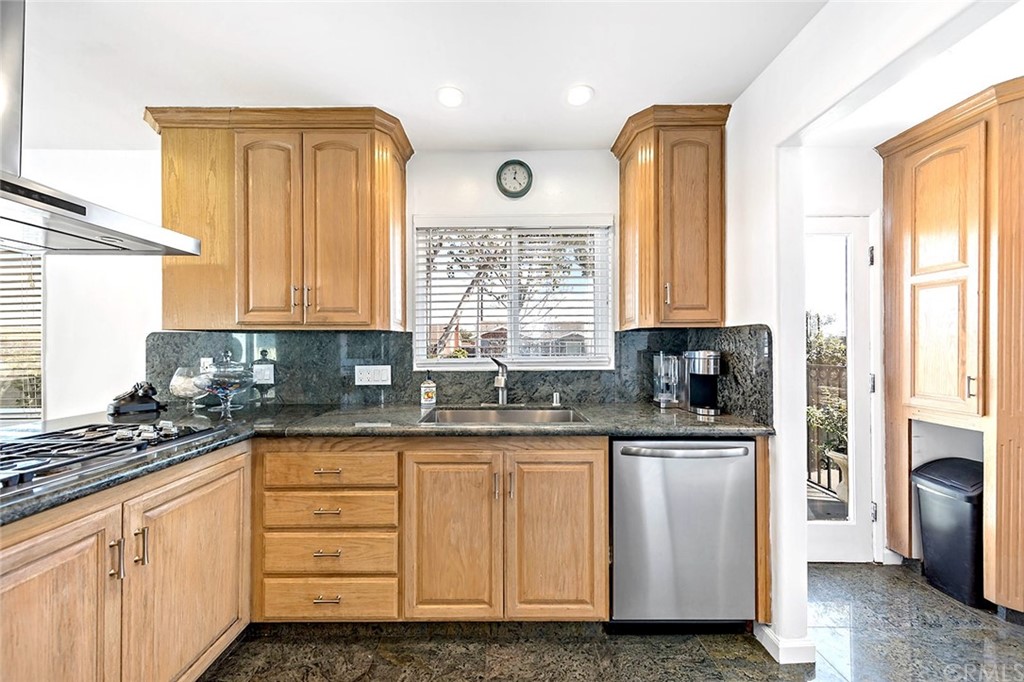 525 East 246th Street Carson, CA 90745 - Photo 8 of 41 a kitchen with white cabinets and window