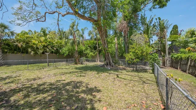 a backyard of a house with lots of green space