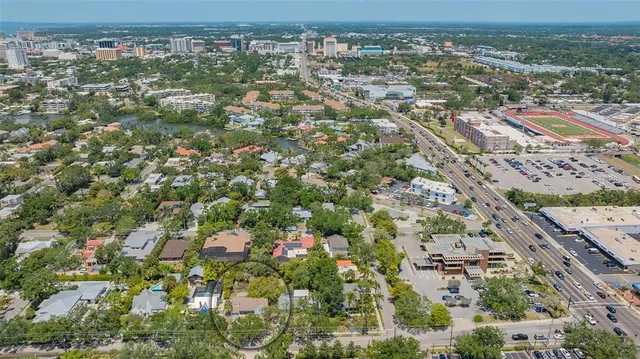 an aerial view of a house with yard