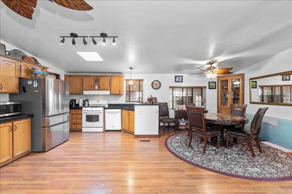 2285 Tierra Heights Road Boulevard, CA 91905 - Photo 11 of 51 a kitchen with stainless steel appliances granite countertop a refrigerator and a stove top oven