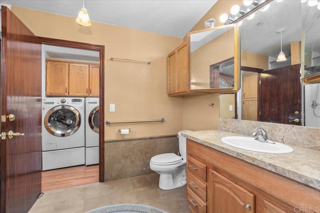 2285 Tierra Heights Road Boulevard, CA 91905 - Photo 20 of 51 a bathroom with a sink toilet and shower