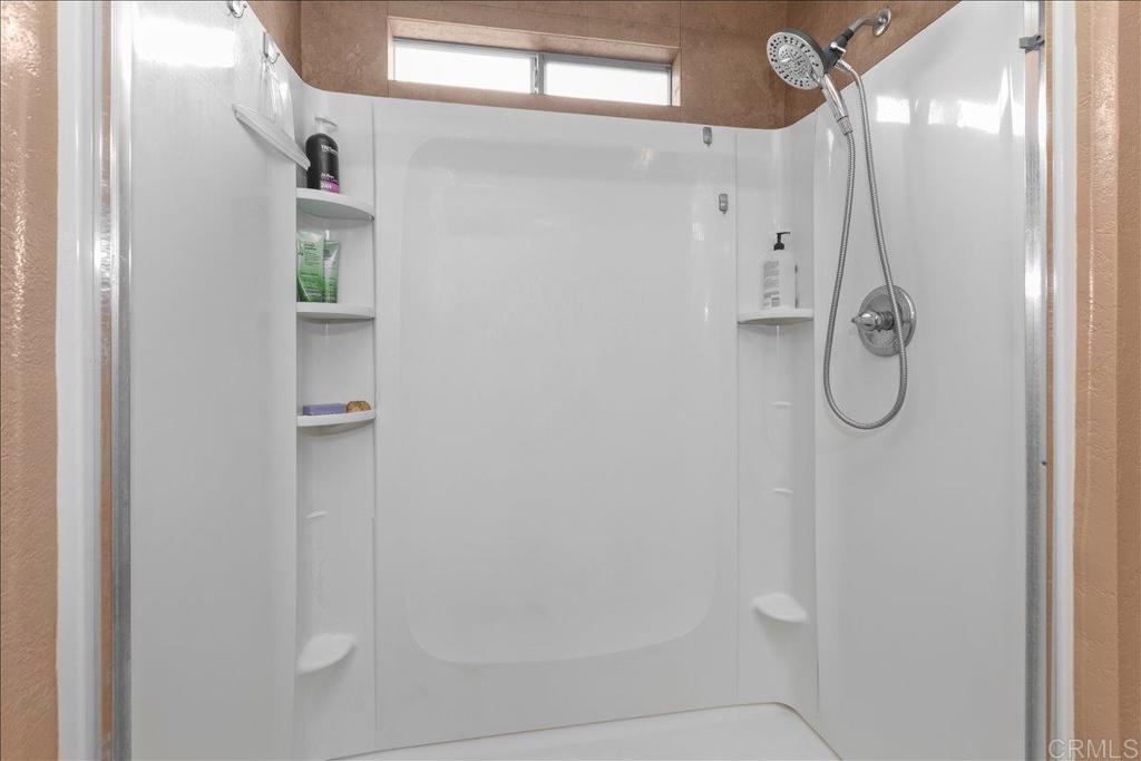 2285 Tierra Heights Road Boulevard, CA 91905 - Photo 21 of 51 a bathroom with a glass shower door