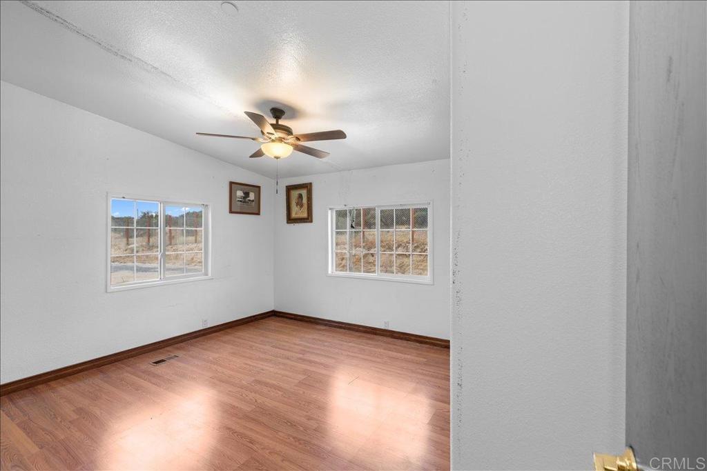2285 Tierra Heights Road Boulevard, CA 91905 - Photo 24 of 51 wooden floor in an empty room with a window