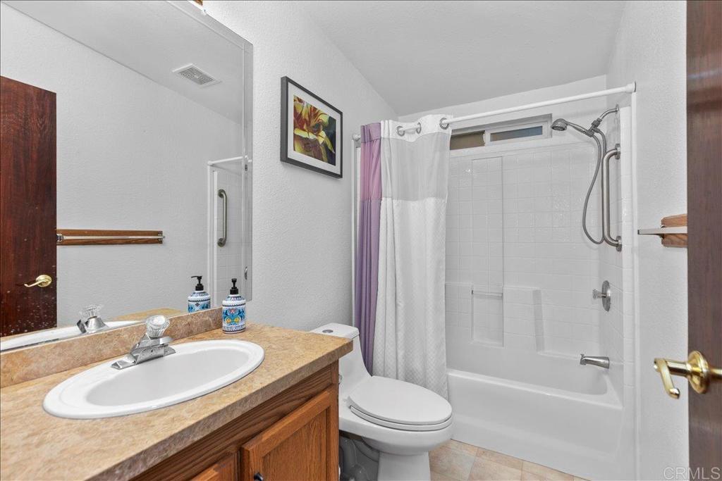2285 Tierra Heights Road Boulevard, CA 91905 - Photo 25 of 51 a bathroom with a sink toilet and shower