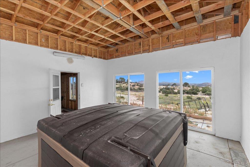2285 Tierra Heights Road Boulevard, CA 91905 - Photo 26 of 51 a bed sitting in a spacious bedroom next to a window