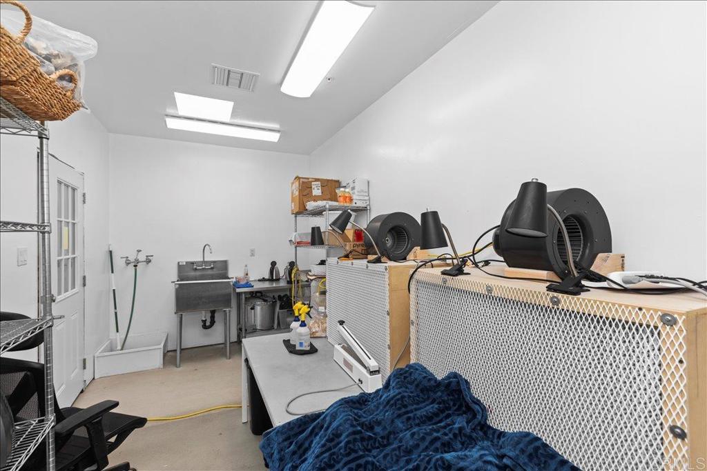 2285 Tierra Heights Road Boulevard, CA 91905 - Photo 28 of 51 a bedroom with a bed and a desk