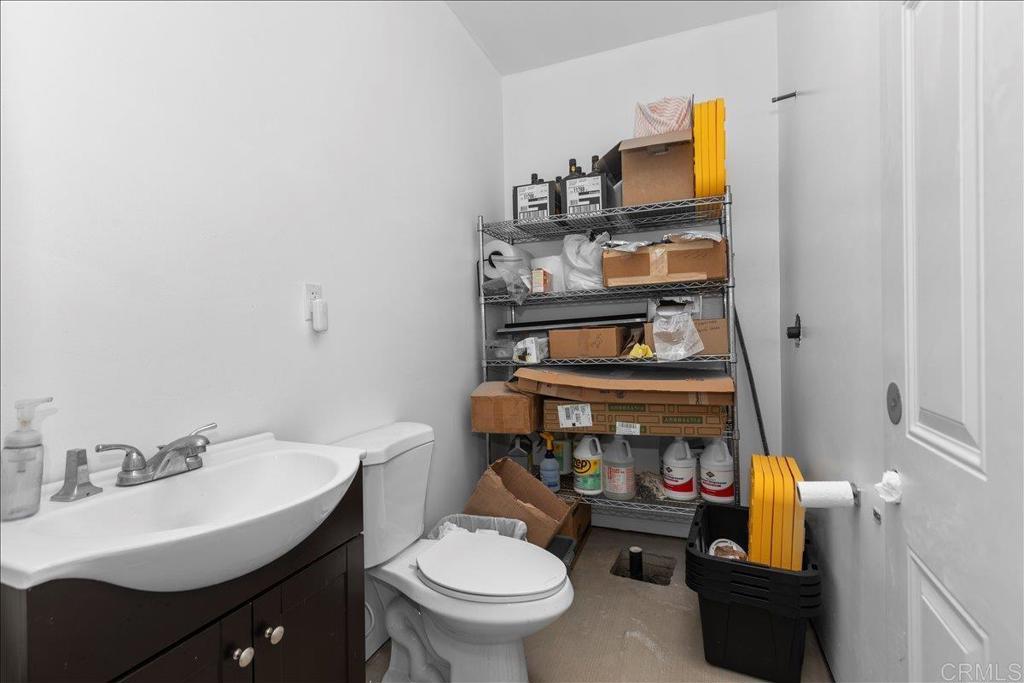2285 Tierra Heights Road Boulevard, CA 91905 - Photo 30 of 51 a bathroom with a sink toilet and mirror