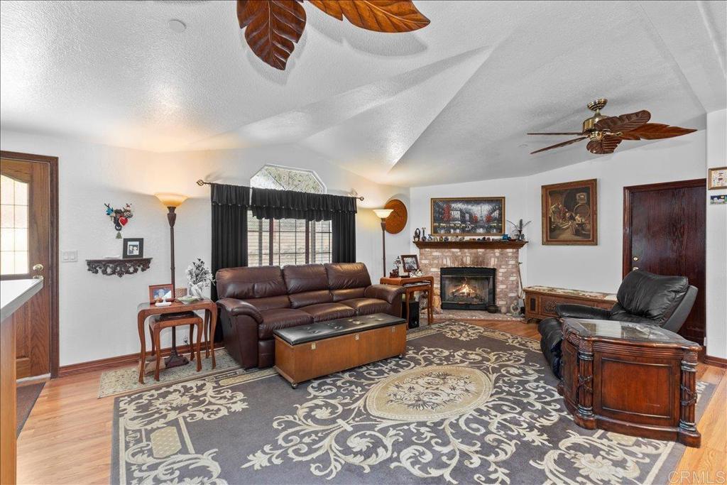 2285 Tierra Heights Road Boulevard, CA 91905 - Photo 5 of 51 a living room with furniture and a fireplace