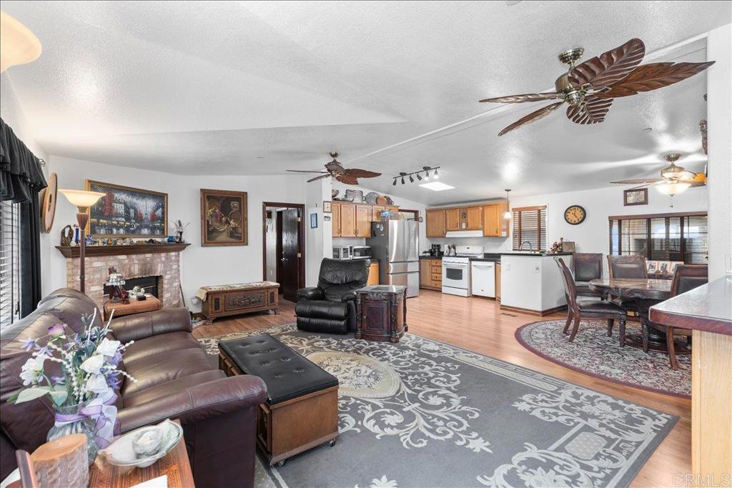 2285 Tierra Heights Road Boulevard, CA 91905 - Photo 6 of 51 a living room with furniture and wooden floor
